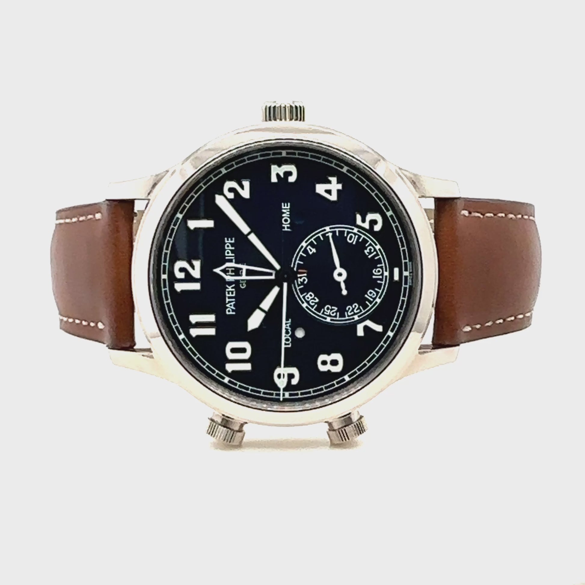 Patek Philippe Pilot Travel Time Armbanduhr
in 750 Weißgold mit Automatikwerk